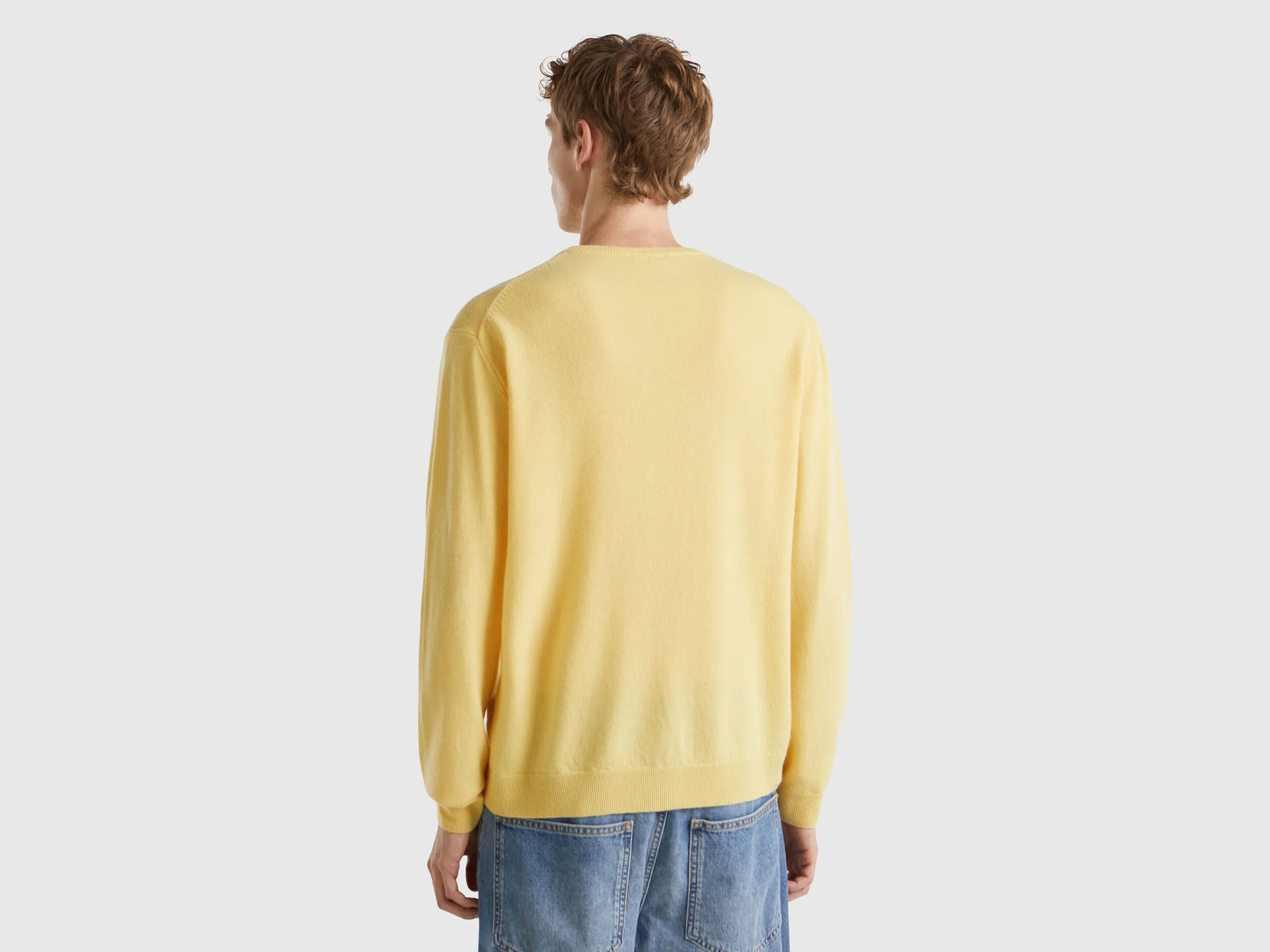 Yellow crew neck sweater in pure Merino wool - Yellow | Benetton