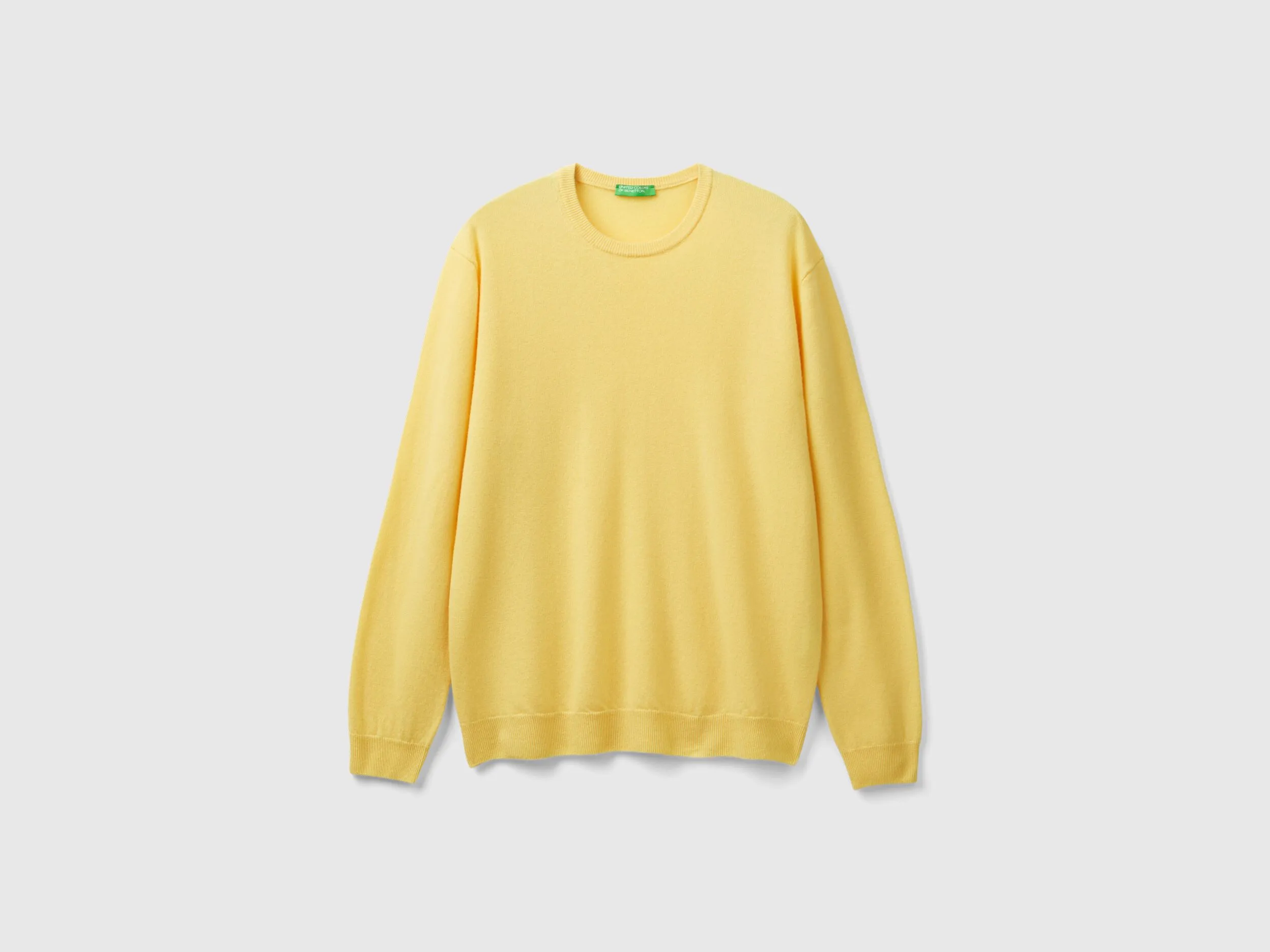 Yellow crew neck sweater in pure Merino wool - Yellow | Benetton